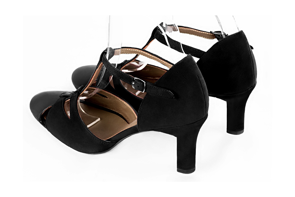 French elegance and refinement for these gloss black dress T-strap open side shoes, 
                available in many subtle leather and colour combinations. A pretty model with a comfortable "Salomé" strap and good support.
Its charming spyglass cut-out gives you plenty of scope for personalisation.  
                Matching clutches for parties, ceremonies and weddings.   
                You can customize these shoes to perfectly match your tastes or needs, and have a unique model.  
                Choice of leathers, colours, knots and heels. 
                Wide range of materials and shades carefully chosen.  
                Rich collection of flat, low, mid and high heels.  
                Small and large shoe sizes - Florence KOOIJMAN